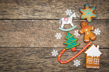 Gingerbread cookies over wooden background