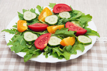 Fresh salad with tomatoes, rucola and cucumbers