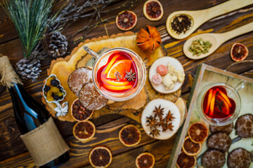 christmas cookies and mulled wine on wooden background