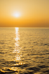 Sunny path on the sunset sea.