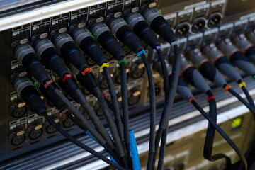 Fototapeta na wymiar Audio snake and stage box with xlr cables and jacks at a live show