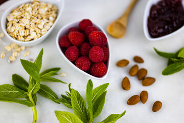 oats with raspberries on white background