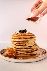 stack of pancakes with honey