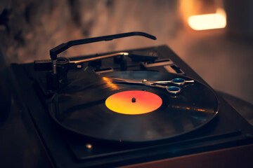 Close up of scissors on vinyl record. Barber shop.