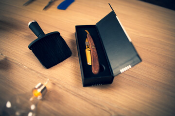 Close up of accessories for barber shop. Scissors, razor, trimmer.
