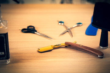 Close up of accessories for barber shop. Scissors, razor, trimmer.