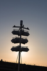 sunset in the mountain and directing signs.