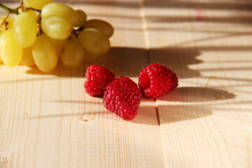 raspberries on wooden background