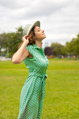 Relaxed young woman breathing fresh air in a park