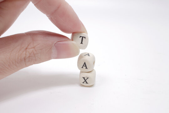 Text Tax On Wood Cubes, Stock Investment Concept.