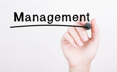 Hand writing Management with black marker on transparent wipe board