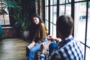 Pensive young colleagues discussing startup plans