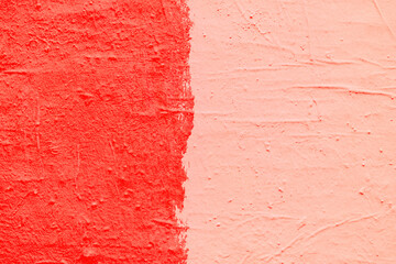 Red paint texture. Interior of a modern loft. Abstract bright background. The facade of an old house. Divided in half.