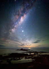 Milky way over the coast as dawn approaches