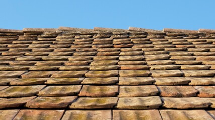old roof tile and a sky