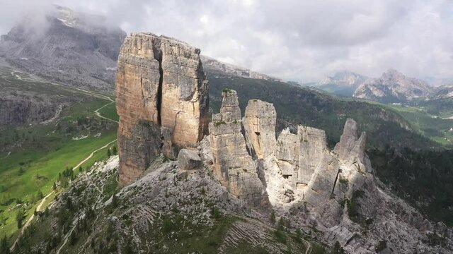 Circling around beautiful rock formations of Cinque Torri in the Dolomites, outdoor travel and mountain scenery in Italy
