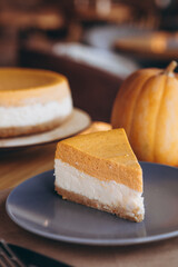 Slices of Freshly Baked Pumpkin Pie on cozy cafe background, selective focus, noise effect