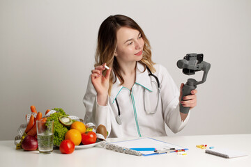 Nutritionist records a video blog about healthy eating on a mobile phone