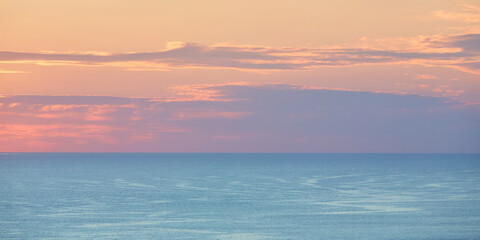 Calm sea and water texture idea. Ocean landscape and sunset. Virgin nature golden hour and seascape concept, copy space