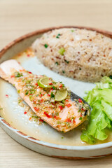 quinoa fried rice with steamed salmon in lime chilli dressing