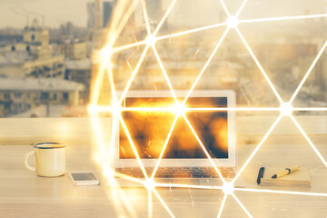 Computer on desktop with social network hologram. Multi exposure. Concept of international people...