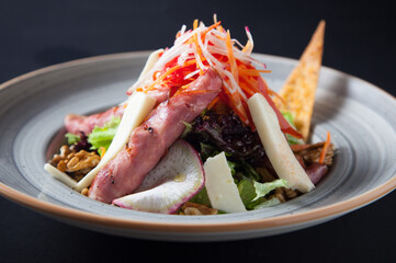 Salad with lettuce, cheese, walnut, carrot, radish