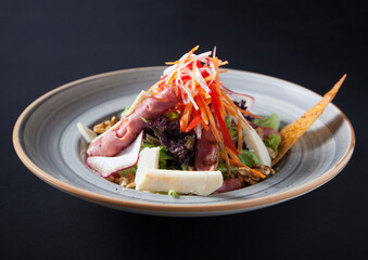 Salad with lettuce, cheese, walnut, carrot, radish