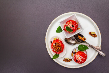Watermelon ice cream or sorbet with coconut flakes, walnuts and fresh basil leaves