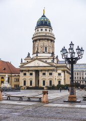 Fototapeta premium large square with a church. square with street lamps in rainy weather. walk in berlin