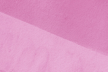 Fototapeta premium Texture of pink plaster. Interior of a modern loft. Abstract rough background. The facade of an old house.
