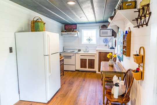 Long and Narrow kitchen in a hunting cabin rental with a metal interior ceiling and shiplap walls