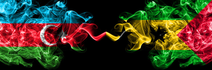 Azerbaijan, Azerbaijani vs Sao Tome and Principe smoky mystic flags placed side by side. Thick colored silky abstract smoke flags