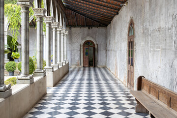 walkway path with checkered pattern marble tiles floor in old gothic church