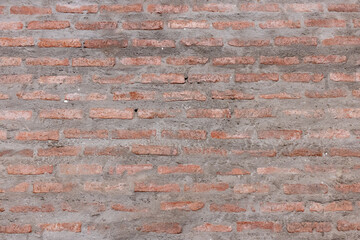 orange brick in gray concrete or cement wall texture background