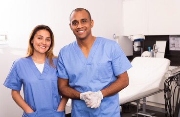 Obraz premium Portrait of two successful professional Hispanic cosmeticians in modern medical esthetic office