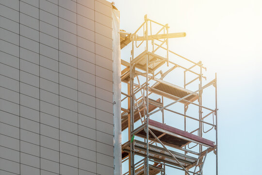 Scaffolding standing against the multi-story building