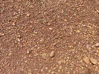 The surface of the stone or the surface of the gravel