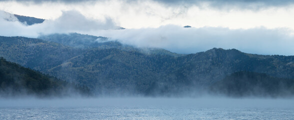 Foggy morning on the Yenisei River, Siberia. Panoramic view.