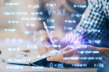 Student or teacher with mathematical and scientific formulas. Concepts of education.