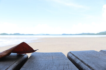 Empty old wooden vintage wooden in front of tidal current the sea, mountain and blue sky...
