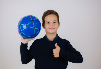 little boy with soccer ball isolated in white