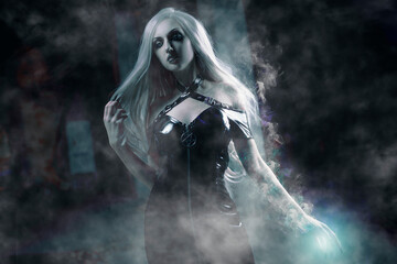 Gorgeous young sorceress, halloween concept, spell casting