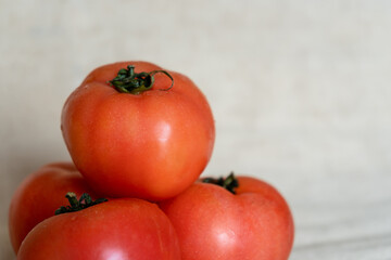 Fresh and natural red tomatoes composition. Concept of vegan and healthy.