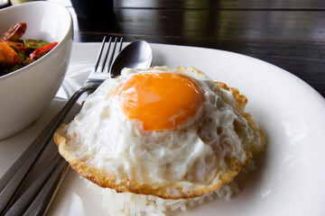 Crispy fried egg sunny side up raw yolk