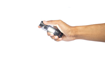 Male hand holds a black metal flashlight on white background