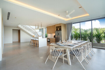 Interior design in pool villa, house and home feature dining table and dining chair in dining room with pool view