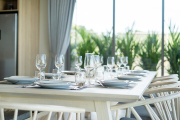 Interior design in pool villa, house and home feature dining table and dining chair in dining room with pool view