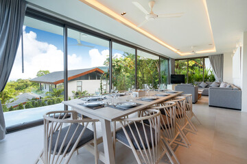 Interior design in villa, house, home, condo and apartment feature sofa, middle tale and television in living room with view