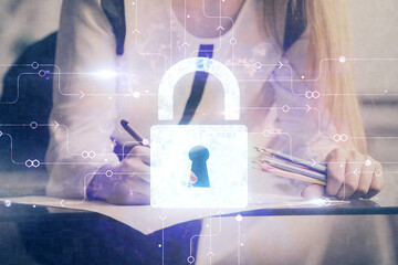 Double exposure of hands making notes with lock icons. Concept security and protection of data
