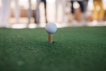 Golf ball on tee ready to be shot